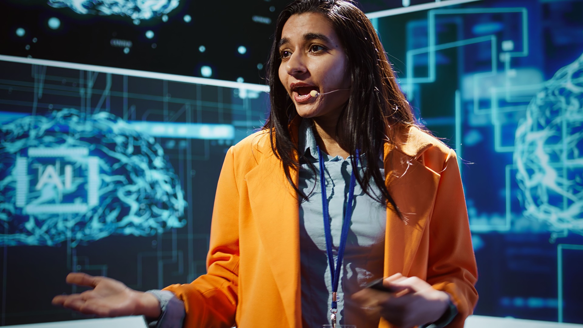 Speaker talking with audience on stage at AI conference